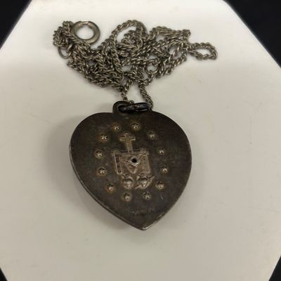LOT 66: Sterling Miraculous Medal on Mother of Pearl Heart Pendant 7.6gtw (Silver-Tone Chain) with Sterling and Marcasite Miraculous...