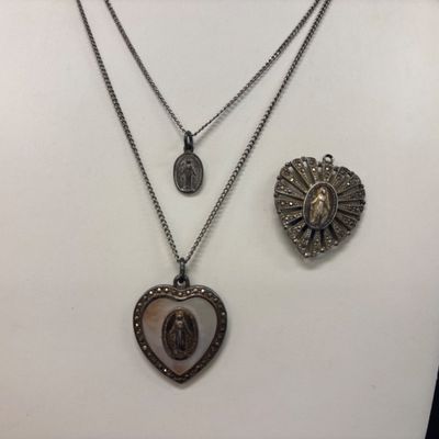 LOT 66: Sterling Miraculous Medal on Mother of Pearl Heart Pendant 7.6gtw (Silver-Tone Chain) with Sterling and Marcasite Miraculous...