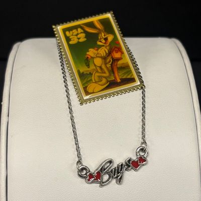 LOT 65: Sterling Silver Winnie the Pooh Pendant on Silver-Tone Chain, Mickey Mouse Watch & Bugs Bunny Necklace and Pin