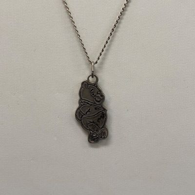 LOT 65: Sterling Silver Winnie the Pooh Pendant on Silver-Tone Chain, Mickey Mouse Watch & Bugs Bunny Necklace and Pin