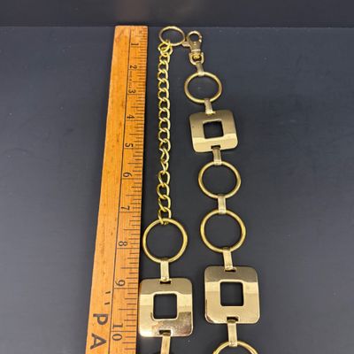 LOT 41: Vintage Belts, Red Enamel Costume Jewelry, Cat-Themed Ashtray and Pin & More