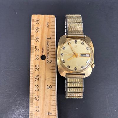 LOT 103: Bulova Accutron 14k Gold Case Watch F49271