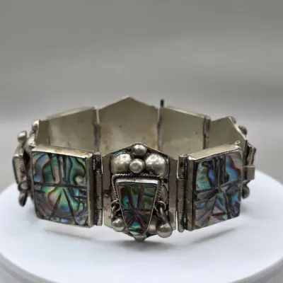 LOT 55: Two Pairs of Vintage Sterling Silver Earrings (13.6gtw) and an Aztec Panel Bracelet with Inlaid Abalone