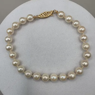 LOT: 56 Vintage Culture Pearl Demi Parure Necklace 20" Bracelet 9" with 14k Closures.