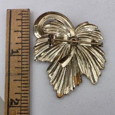 LOT 63: Vintage Gold Tone Brooches
