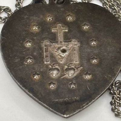 LOT 66: Sterling Miraculous Medal on Mother of Pearl Heart Pendant 7.6gtw (Silver-Tone Chain) with Sterling and Marcasite Miraculous...