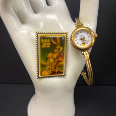 LOT 65: Sterling Silver Winnie the Pooh Pendant on Silver-Tone Chain, Mickey Mouse Watch & Bugs Bunny Necklace and Pin