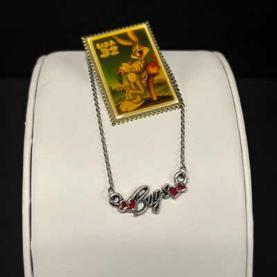 LOT 65: Sterling Silver Winnie the Pooh Pendant on Silver-Tone Chain, Mickey Mouse Watch & Bugs Bunny Necklace and Pin