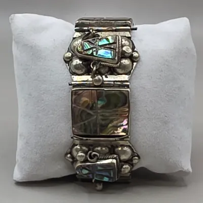 LOT 55: Two Pairs of Vintage Sterling Silver Earrings (13.6gtw) and an Aztec Panel Bracelet with Inlaid Abalone