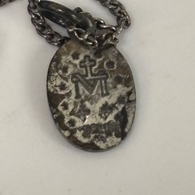 LOT 66: Sterling Miraculous Medal on Mother of Pearl Heart Pendant 7.6gtw (Silver-Tone Chain) with Sterling and Marcasite Miraculous...