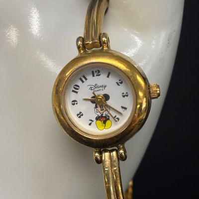 LOT 65: Sterling Silver Winnie the Pooh Pendant on Silver-Tone Chain, Mickey Mouse Watch & Bugs Bunny Necklace and Pin