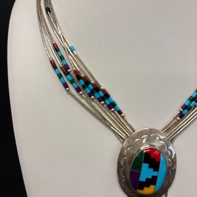 LOT 83: Multi-Strand Liquid Silver Beaded Necklace Featuring a Natural Gemstone Inlay Pendant 27.2gtw