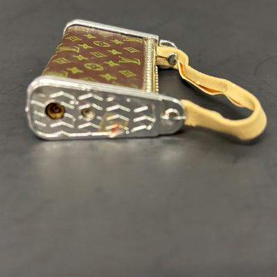 LOT 36: Vintage and Contemporary Lighters with Keychains & More