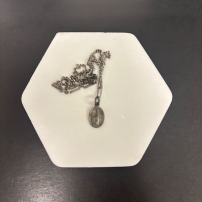 LOT 66: Sterling Miraculous Medal on Mother of Pearl Heart Pendant 7.6gtw (Silver-Tone Chain) with Sterling and Marcasite Miraculous...