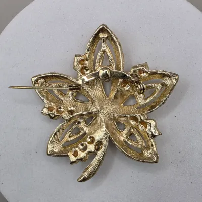 LOT 63: Vintage Gold Tone Brooches