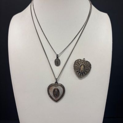LOT 66: Sterling Miraculous Medal on Mother of Pearl Heart Pendant 7.6gtw (Silver-Tone Chain) with Sterling and Marcasite Miraculous...