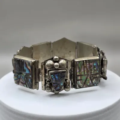 LOT 55: Two Pairs of Vintage Sterling Silver Earrings (13.6gtw) and an Aztec Panel Bracelet with Inlaid Abalone