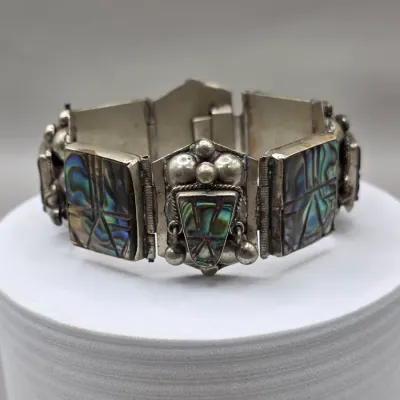 LOT 55: Two Pairs of Vintage Sterling Silver Earrings (13.6gtw) and an Aztec Panel Bracelet with Inlaid Abalone