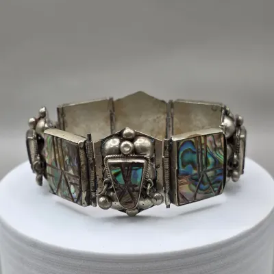 LOT 55: Two Pairs of Vintage Sterling Silver Earrings (13.6gtw) and an Aztec Panel Bracelet with Inlaid Abalone