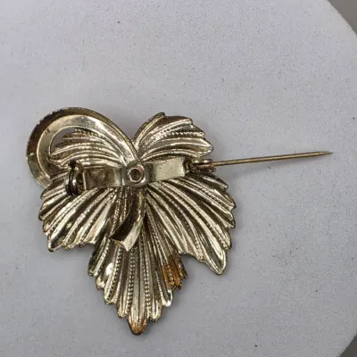 LOT 63: Vintage Gold Tone Brooches