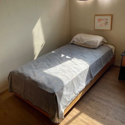 Two 1970s custom-built twin platform beds with rollers. 