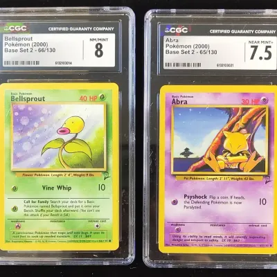 2 2000 Pokemon Cards Base Set 2 Bellsprout & Abra CGC Graded