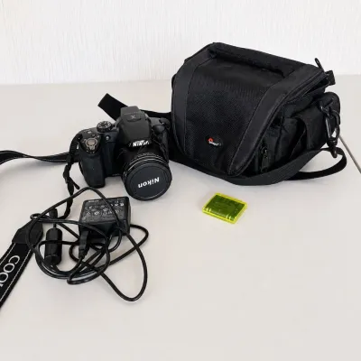Sale Photo Thumbnail #19: Nikon COOLPIX P510 digital bridge camera featuring a powerful 42x optical zoom NIKKOR lens. Camera includes Lowepro padded carrying bag, Nikon EH-69P AC adapter/charger, battery, lens cap, and neck strap.

Features include:

● 16.1-megapixel CMOS sensor