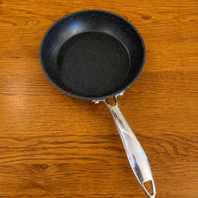 Sale Photo Thumbnail #229: This Granite Stone Diamond Pro skillet set includes three skillets featuring a durable non-stick granite coating for excellent cooking performance and easy cleaning. The black speckled surface is both stylish and functional, providing even heat distributi