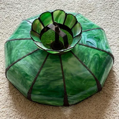 Sale Photo Thumbnail #30: This exquisite stained glass hanging lamp shade features a vibrant green color with swirling patterns, creating a timeless and elegant look. Measuring 24 inches in diameter with a 13-inch height to the top of the hook, it is made from beautifully crafted 