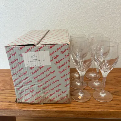 Sale Photo Thumbnail #141: This elegant set features six BleiKristall white wine glasses, each measuring 7.5 inches tall. Crafted from premium lead crystal in Germany, these glasses showcase the unique Turning Point design with intricate cut patterns. The clear crystal material hig