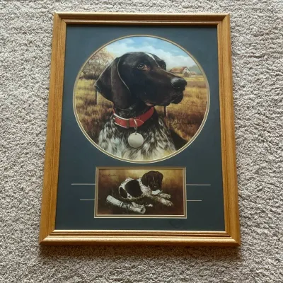 Sale Photo Thumbnail #85: This framed art print showcases a 1996 painting by Larry Chandler, featuring a detailed portrait of an English Pointer dog with a red collar and tag. The piece includes two separate images: a large circular portrait of the dog's head against a rustic outd