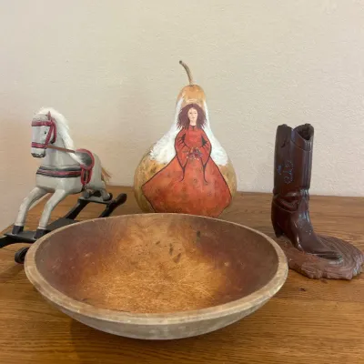 Sale Photo Thumbnail #277: This assorted collection of wooden collectibles showcases a beautifully hand-painted gourd with a distinctive design of a woman in a flowing red dress, standing at approximately 9 inches tall. The set also includes a rustic wooden bowl, a vintage-style wo