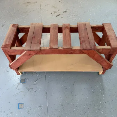 Sale Photo Thumbnail #325: This robust chest dolley features a durable wooden frame designed for heavy-duty use. Measuring 24 inches in height and 46 inches in length, it is ideal for moving and storing chests or large items with ease. The dolley is constructed from solid wood with
