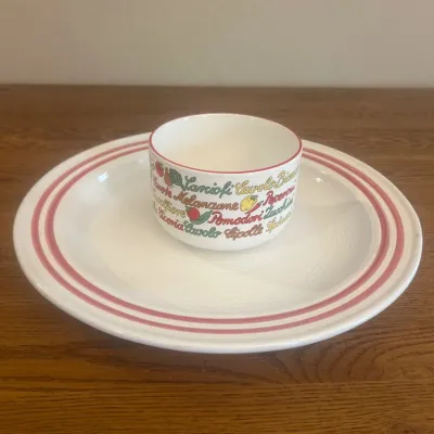 Sale Photo Thumbnail #254: This charming ceramic soup bowl and serving dish set features vibrant Italian vegetable graphics around the bowl, including tomatoes, carrots, and other fresh produce. The bowl measures approximately 4 inches in height and 6 inches in diameter, while the 