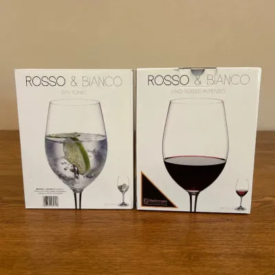Sale Photo Thumbnail #233: This elegant set includes four Nachtmann Rosso & Bianco crystal wine glasses, crafted in Germany with high-quality crystal lead-free glass. The set features two types of glasses specifically designed to enhance your wine experience: Rosso for intense red 