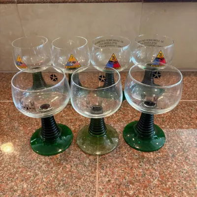 Sale Photo Thumbnail #300: This set of 7 Luminarc Roemer style wine goblets features a distinctive green beetive or ribbed stem, adding a unique touch to each glass. These military collectible goblets stand 5.5 inches tall with a 3-inch diameter, making them perfect for display or 