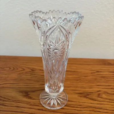 Sale Photo Thumbnail #143: This exquisite Nachtmann Bleikristall Florence Vase stands 8.5 inches tall and showcases stunning intricate cut glass patterns typical of fine lead crystal craftsmanship. The clear crystal vase features a scalloped rim and detailed floral and geometric de