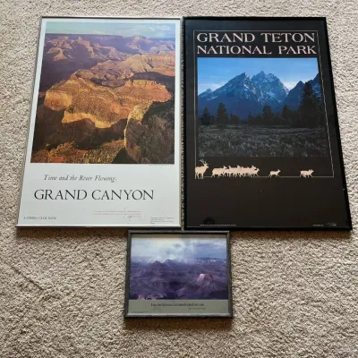 Sale Photo Thumbnail #111: This collection includes a 1968 Sierra Club book-style print titled 'Time and the River Flowing: Grand Canyon,' featuring a stunning aerial view of the canyon with warm earthy tones, framed in a sleek silver frame. Accompanying it is a limited edition 'Gr