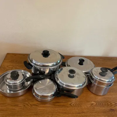 Sale Photo Thumbnail #137: This MultiCore stainless steel pot and pan set includes various sizes ideal for versatile cooking needs. Made from durable stainless steel, the set features a 12-quart large pot measuring approximately 10.5 inches in height and 12 inches in diameter, perf
