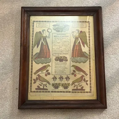 Sale Photo Thumbnail #106:  Decorative framed Certificate of Birth & Baptism featuring colorful religious and folk-art style imagery including angels, birds, flowers, and ornamental borders. The certificate contains handwritten family and baptismal information, with dates including