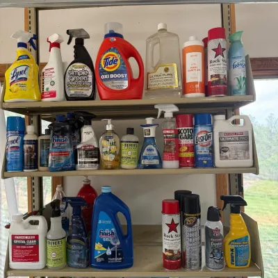 Sale Photo Thumbnail #199: This extensive collection of household cleaning supplies features a wide range of products designed to tackle various cleaning tasks efficiently. The set includes multiple spray bottles, detergents, disinfectants, polishes, and specialty cleaning agents. 