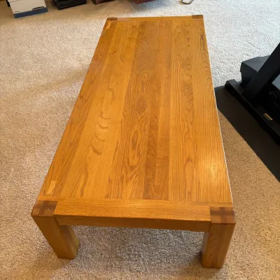 Sale Photo Thumbnail #191: This elegant solid wooden coffee table features a warm natural wood finish that beautifully showcases the grain patterns. Measuring 15.5 inches tall, 71 inches long, and 30 inches wide, it offers ample surface space for your living room essentials. Crafte