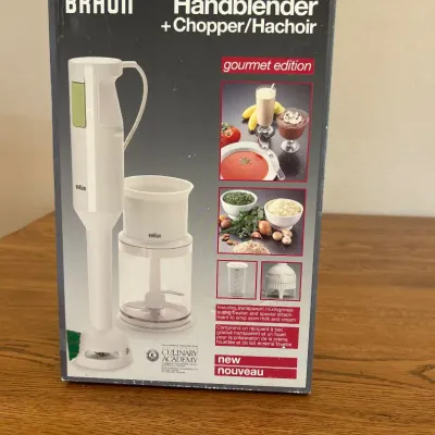 Sale Photo Thumbnail #237: Experience versatile and efficient food preparation with the Braun Hand Blender and Chopper MR 380, Gourmet Edition. This compact system features a powerful hand blender and a convenient chopper attachment, perfect for chopping, blending, and pureeing a v
