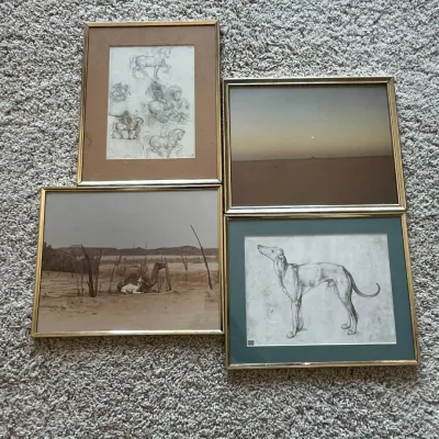 Sale Photo Thumbnail #120: This collection includes four framed art prints, each showcasing distinct artistic themes. The first print features detailed pencil sketches of horses in various poses, highlighted by a brown matte and a gold frame. The second depicts a serene desert land