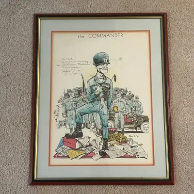 Sale Photo Thumbnail #49: Framed vintage military humor print titled “The Commander” by American military artist George Finley. The detailed caricature depicts a U.S. Army commander surrounded by soldiers, military equipment, paperwork and other humorous references to Army lif