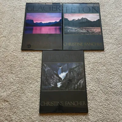 Sale Photo Thumbnail #105: Set of three vintage Christine Fancher landscape photography posters featuring iconic scenes from three U.S. National Parks: Glacier National Park, Grand Teton National Park, and Yellowstone National Park.

Each poster features a photographic landscape by