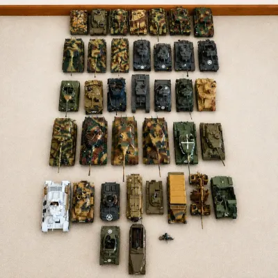 Sale Photo Thumbnail #53: A comprehensive collection of WWII military tank and vehicle models featuring detailed craftsmanship and authentic camouflage paint schemes. The set includes various tank models, artillery pieces, and reconnaissance vehicles, each showcasing realistic mil