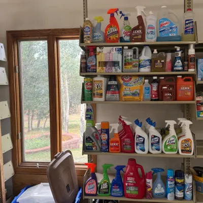 Sale Photo Thumbnail #198: This lot features a diverse collection of general cleaning supplies including sprays, detergents, disinfectants, and specialty cleaners. The items are a variety of brands, packaging sizes, and cleaning purposes; such as multi-surface cleaners, bathroom, k