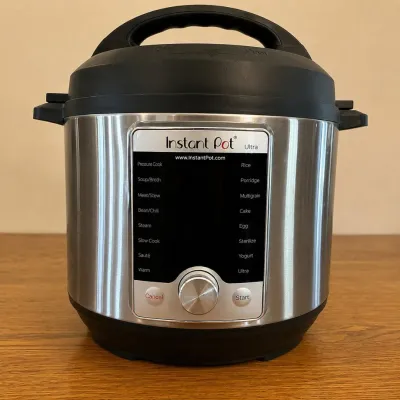 Sale Photo Thumbnail #234: This Instant Pot Ultra is a versatile multi-use pressure cooker designed to simplify cooking with its advanced features. It boasts a sleek stainless steel exterior paired with a digital control panel and a central dial for easy menu navigation. The cooker