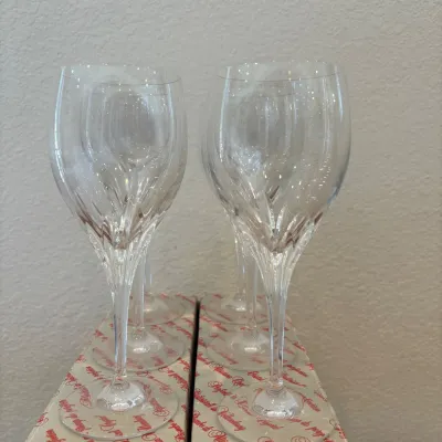 Sale Photo Thumbnail #146: This elegant set of six  Nachtmann Bleikristall  'Turning Point' crystal wine glasses features a classic goblet shape with intricate faceted details that catch the light beautifully. Each glass measures 8 inches tall and is crafted from high-quality cryst